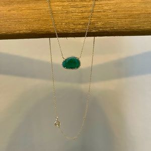 14k yellow gold necklace with raw emerald stone and diamond pendent